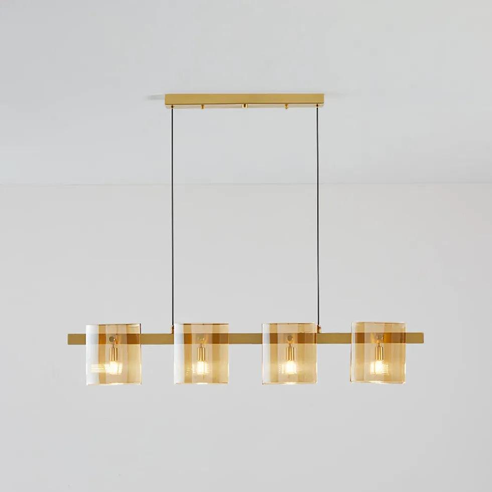 Messingfarbene und gläserne Pendelleuchte fürs Esszimmer | livraina